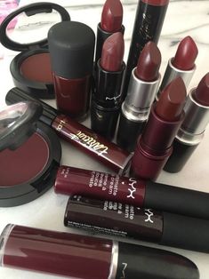 various lipsticks are arranged on a table