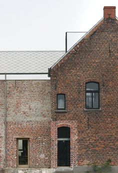 an old brick building with a clock tower