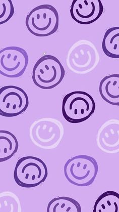 purple and white smiley face wallpaper with circles on the bottom, in different colors