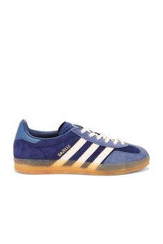 Suede upper and rubber sole.  Made in Vietnam.  Lace-up front.  Gold-tone Gazelle logo detail at side.  Adidas logo detail at textured tongue and back counter.  Cushioned collar.  Additional laces included.  .  .  .  .  .  .  .  .  . Adidas Logo, Adidas Originals, Rubber Sole, Vietnam, Dark Blue, Lace Up, Adidas, Collar, Sneakers