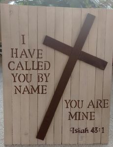 a wooden sign with a cross and the words i have called you by your name