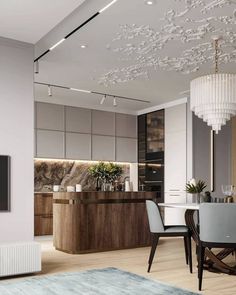 an elegant dining room with modern furniture and chandelier