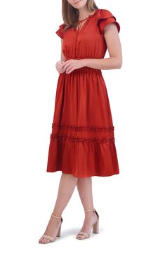 Frilly ruffles dance around the neckline and skirt of this swingy midi dress framed by layered short sleeves. 46" length (size 8) Ties at neck Split neck with ties Short sleeves Lined 100% polyester Dry clean Imported Fit And Flare A-line Midi Dress With Ruffles, Flowy Tiered Pleated Midi Dress, Fit And Flare Knee-length Midi Dress With Ruffle Hem, Knee-length Fit And Flare Midi Dress With Ruffle Hem, Flowy Midi-length Ruffle Dress, Casual Midi Dress With Ruffled Skirt, Flowy Knee-length Midi Dress With Ruffles, Summer Knee-length Ruffle Dress, Spring Midi Length Pleated Ruffle Dress