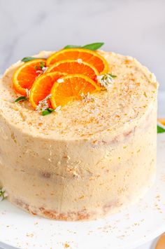 there is a cake with oranges on it