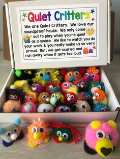 an open box filled with lots of different colored stuffed animals and words written on it