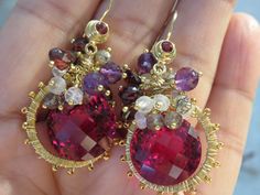 "This earrings is 1-7/8\". Red Topaz faceted round (33.85cts). A cluster of small gemstones : Natural purple Amethyst faceted round beads, Rainbow faceted rondelle beads, Black rutile Quartz faceted rondelle beads and red Quartz faceted heart drops. 14K yellow gold earwire with faceted red Garnet wire, 24K vermeil yellow gold 20mm rings and ball head pins, 24K vermeil yellow gold plated small smooth round beads. High fashion. Wire work. Handmade, beautiful and special design." Purple Garnet Jewelry Gift, Red Jewelry With Faceted Beads, Red Multi-stone Jewelry For Party, Red Multi-stone Party Jewelry, Red Rondelle Beads Jewelry With Faceted Detail, Ruby Jewelry With Faceted Round Beads, Red Faceted Round Beads Jewelry, Faceted Garnet Round Bead Jewelry, Red Topaz