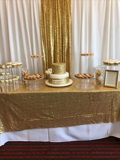 a table topped with a cake and desserts