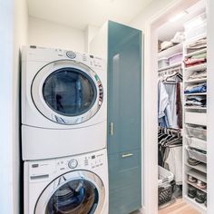 a washer and dryer are in the closet