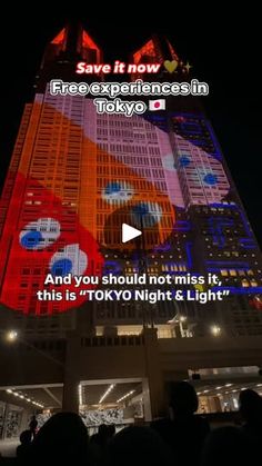 people standing in front of a tall building with lights on it's sides and the words tokyo night & light