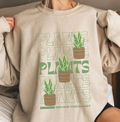 This design is for anyone with a green thumb, people who love plants or gardening. A great gift for plant enthusiasts out there. *This sweatshirt is printed in the United States* *Made from 50% Cotton and 50% Polyester* Our sweatshirts are unisex. Please refer to the size chart in the picture for sizing.  For sweatshirt care, we recommend that you machine wash: warm; non-chlorine bleach as needed; Tumble dry: medium heat; Do not iron; Do not dry clean.  We print our sweatshirts as customers orde Plant Lover Cricut, Cheap White Shirt With Plant Print, Cheap White Shirt With Plants Print, Trendy Plants Print Shirt, Cheap Crew Neck Top With Plant Print, Cheap Women's T-shirt With Plant Print, Cheap Casual Tops With Plant Print, Cheap Graphic Tee With Plants Print, Cheap Trendy Shirt With Plant Print