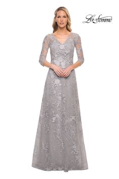 Indulge in the ethereal beauty of the La Femme 29989 A-Line evening dress. Handmade flowers delicately embellish the exquisite lace, creating a look of timeless elegance. With a V-neckline, 3/4 length sleeves, and a zipper closure, this dress exudes sophistication and grace. Make a statement at any special occasion and leave a lasting impression with this enchanting piece. A Line Evening Dress, Dress Handmade, Glamorous Style, Ethereal Beauty, Handmade Flowers, Evening Dress, Special Events, Timeless Elegance, Long Dress