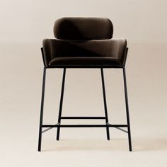 an upholstered bar stool with black frame and leather seat, viewed from the front