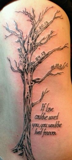 a woman's back with a tree tattoo on her shoulder and the words, if love