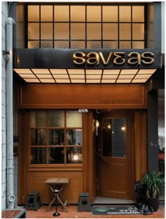 an entrance to a restaurant with the name savas on it's front door