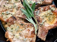 grilled meat with herbs and cheese in a cast iron skillet, ready to be eaten