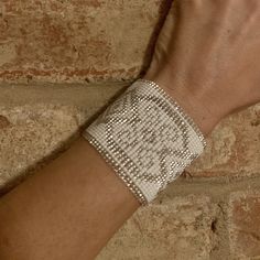 "Beautiful white and silver beaded goddess medicine cuff. My favorite! adjustable to fit 3 sizes. cuff is 6\" (15.25cm) long, plus the clasps make it 8\". smallest adjustment is 7\" around the wrist and larger is 8\" Handmade with glass seed beads." Beaded Cuff Bracelet Gift, Spiritual Beaded Cuff Bracelet Gift, Gold Beaded Cuff Bracelet, Elegant Beaded Cuff Jewelry, Elegant Beaded Cuff Bracelets, Star Goddess, Beaded Cuff Bracelet, Beaded Cuff, Earrings Photo