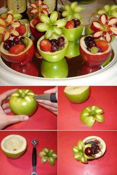 apples and grapes are arranged in flower vases on a platter for fruit carving