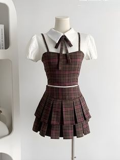 This cute two-piece set, showcasing a plaid design, includes a cropped top with a shirt and tie scarf, featuring zip and button fastening at the back. The matching mini skirt has a pleated, A-line design, high-waisted for a flattering fit, perfect for a kawaii-inspired college style. Kawaii aesthetic Plaid design Top C Plaid Brown Skirt, Skirt With Crop Top Outfit, How To Style Plaid Skirt Outfit, Plaid Skirt Outfit Aesthetic, Plaid Outfits For Women, Crop Top And Skirt Outfit, Short Skirt And Top, Aesthetic Plaid, Academia Clothing