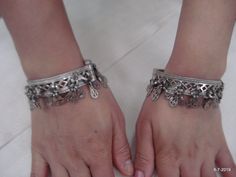 "Vintage Antique ethnic collectible very nice tribal old silver charm Bracelet or bangle pair from Rajasthan India. Worn by Banjara tribal people of Rajasthan. Beautiful workmanship all over the piece, adorn with silver charms. One quarter-hinged part can be open by pin. Original old pair in good condition with great antique look. great pair for jeweley collection. Inner diameter across - 5.3 cm(2\") Inner circumference -16.6 cm (6.5\") width include charms - 2.6 cm(1\") weight for pair - 92.5 g Bohemian Antique Silver Bangle With Oxidized Finish, Silver Oxidized Bangle For Festival, Silver Bangle With Oxidized Finish For Festival, Silver Bracelets With Tilla, Bohemian Silver Bracelets For Festive Occasion, Bohemian Silver Bracelet For Festive Occasion, Silver Tilla Bracelets, Antique Silver Oxidized Bracelets For Rituals, Heavy Silver Bracelet For Festivals