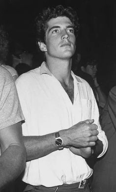 black and white photograph of man with watch on his wrist