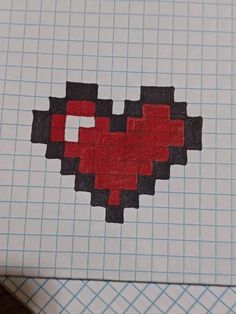 a piece of paper that has been made to look like a pixel heart on it