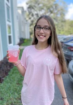 light pink smiley face tee  Handmade and pressed with premium vinyl Machine washable, hang dry to preserve life but dryer OK also!  Returns and exchanges are not accepted however if there are any issues with your item upon arrival, please contact me and I will wirk with you to fix it!  Thank you for supporting Ajaye & Co! Cute Pink Smiley Face Top, Fun Pink Tops With Smiley Face, Fun Pink Smiley Face Tops, Pink Short Sleeve T-shirt With Smiley Face, Trendy Pink Smiley Face Tops, Pink Cotton T-shirt With Smiley Face, Casual Pink T-shirt With Smiley Face, Pink Graphic Tee With Smiley Face, Pink Smiley Face Graphic Tee