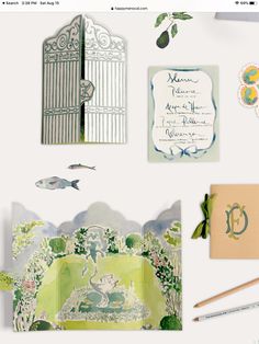 the wedding stationery is laid out and ready to be put into the guest book