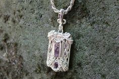 This unique, rectangle-shaped wire wrapped pendant was hand-crafted using a natural Amethyst point as the centerpiece and various amethyst facets. These gems have been whimsically wrapped up in .925 sterling silver wire using intricate patterns and details, making it a completely unique and one of a kind piece.  This piece features a hanging bale which allows it to have more movement when it hangs from a necklace. Size Dimensions:   L* ~3.25 inches  W* ~1.25 inches *Chain not included in purchase* Artist based out of Portland, Oregon "Mindful Meandering Creations is my way of expressing creativity and sharing the love and power that working with crystals brings. I hope that through mindful practices we all as humans can come together to continue to make the world a beautiful place to call Silver Rectangular Wire Wrapped Jewelry, Rectangular Silver Wire Wrapped Jewelry, Rectangular Hand Wrapped Jewelry Gift, Hand Wrapped Rectangular Bohemian Jewelry, Bohemian Hand Wrapped Rectangular Jewelry, Rectangular Purple Amethyst Necklaces, Purple Rectangular Amethyst Necklaces, Purple Rectangular Amethyst Necklace, Handmade Purple Rectangular Necklace