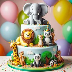 there is a cake with animals on it and balloons in the backgroung