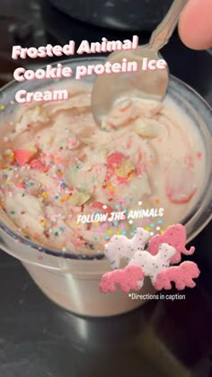 an ice cream dish with sprinkles and powdered animal cookies in it