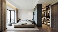 a bedroom with a large bed and lots of closet space next to the window that looks out onto the city