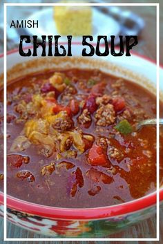 a bowl of chili soup with bread in the background and text overlay reading amish chili soup