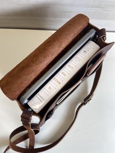 Made with the minimalist in mind, this messenger bag is perfect for the student or professional on the go. Hold books and tablets up to 10” and features 3 front pockets for phone and other essentials. Coming soon in 15" laptop size. Made from full grain leather. Handmade in Austin, Texas!