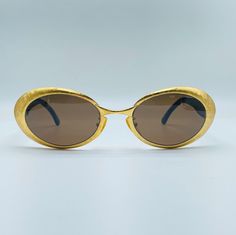 Fendi  Mod SL 7090 COL Q45 , 90s , vintage gold and tortoise small oval cat eye sunglasses , women & men frames,NOS,Made in İtaly ✓ BRAND: Fendi ✓ Made in İtaly ✓ YEAR: 90's ✓ MODEL: 7090 COL Q45 ✓ CONDITION: NOS #  NEW OLD STOCK (Never Worn Before) ✓ SIZE :  #WIDE ACROSS THE FRONT: 140 mm / 5.51 inch #VERTICAL HEIGHT OF THE FRAME: 43 mm / 1.69 inch #TEMPLE: 120 mm / 4.72 inch ✓ MATERIAL #FRAME: Gold Metal And Acetate #LENSES:  %100 UV Protection ✓ COMMENT All of our products are vintage eyewear which is new old stock (NOS) and these items have never been worn. We're delivering our products in small boxes with a cleaning cloth. Vintage Oval Sunglasses For Formal Occasions, Vintage Gold Round Frame Sunglasses, Gold Oval Sunglasses For Formal Occasions, Formal Gold Oval Sunglasses, Vintage Gold Sunglasses For Formal Occasion, 90s Model, Cat Eye Sunglasses Women, Vintage Eyewear, Eye Wear Glasses