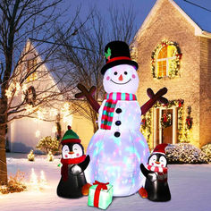 a snowman and two penguins in front of a house with christmas lights on it