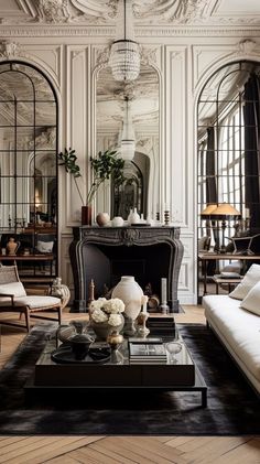 a living room filled with furniture and a fire place in front of a mirror wall