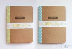 two brown notebooks with blue and white paper on them, one has a label that says shop pretty