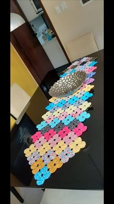 the table is covered with many different colored buttons