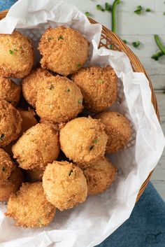 a basket filled with fried food on top of a table