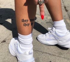 a woman's legs with tattoos on them and the words they run their way