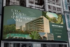 a large billboard on the side of a building in front of a tall building with balconies