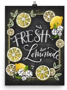 a black and white framed print with lemons, flowers and the words fresh lemonade