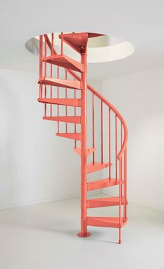 an orange spiral staircase in a white room