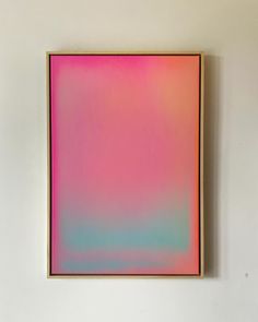 an abstract painting hangs on the wall