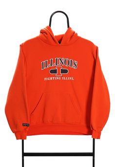 Orange hoodie with Illinois Fighting Illini logo. Good condition. Size (Approx. in: cm: Pit to Pit: 48, Length: 54 Team-colored Long Sleeve Hoodie For Streetwear, Sportswear Hoodie With Logo Print, Sports Hoodie With Logo Print For Fall, Collegiate Crew Neck Hoodie For Sports, Varsity Hoodie For Sports Events, Fan Gear Long Sleeve Hoodie With Logo Print, Fleece Hoodie With Logo Print For Sports Season, Winter Sports Logo Print Hoodie, Sporty Hooded Hoodie For Fan Gear