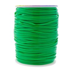 a spool of neon green wax cord on a white background with clippings