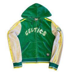 a green and white jacket with the word celtics on it's chest, in front of a white background