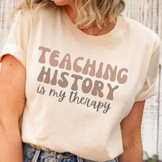 This history shirt makes a totally unique history gift for history teachers and professors, especially during Teacher Appreciation Week and more! Grab this tee today while it's on sale! Delivery Times: ◦ Production: 1 business day on average (maximum: 5) ◦ Shipping: 2 business days on average (maximum: 5) Unisex Fit: ◦ Extra soft, preshrunk unisex t-shirt ◦ Women: Semi-fitted, laidback, rollable, & tuckable ◦ Men: Fitted on upper body & loose around the belly ☞ Size up for a looser fit Soft Materials: ◦ Super soft, preshrunk tee with eco-friendly materials ◦ Black, White, & Navy: 100% soft ring spun cotton ◦ Heather Navy: 65% polyester & 35% cotton ◦ Sport Grey: 90% cotton & 10% polyester History Teacher Shirt, History Teacher Gifts, Funny History, Gifts For History Buffs, Great Grandma Gifts, Funny Teacher Gifts, History Teacher, Botanical Shirt, Gardening Shirts