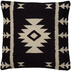 a black and white pillow with an arrow design on the front, sitting on a white background