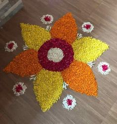 an arrangement of flowers on the floor for diwaling